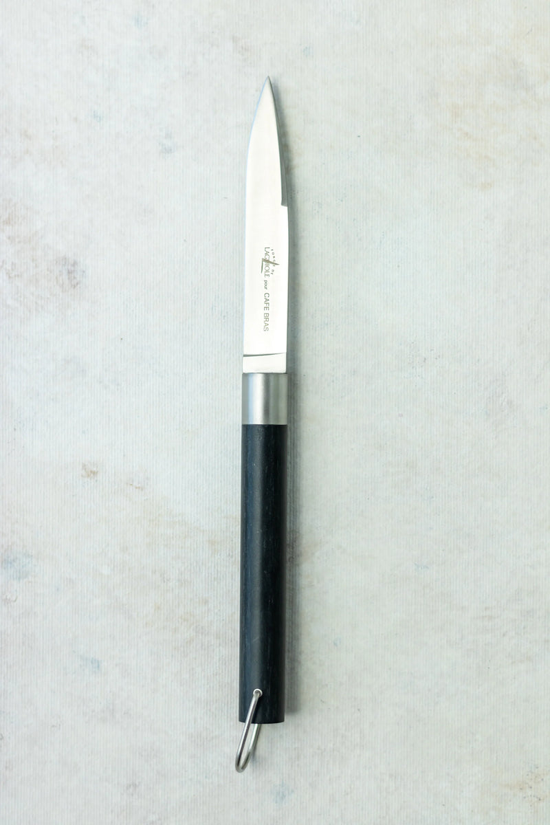 T BRASS PC Description : Couteau à steak « Café Bras » dessiné par Michel Bras, manche en fibre végétale composite noir, longueur totale 22 cm, finition mate
